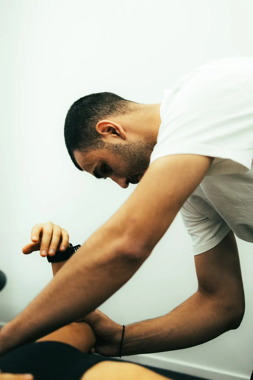 Close-up of hands-on movement assessment at DVOTION