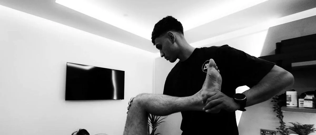 Chris Gkoufas assessing a client's movement